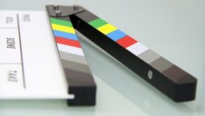 Un ciak per rappresentare la produzione al Cineporto.